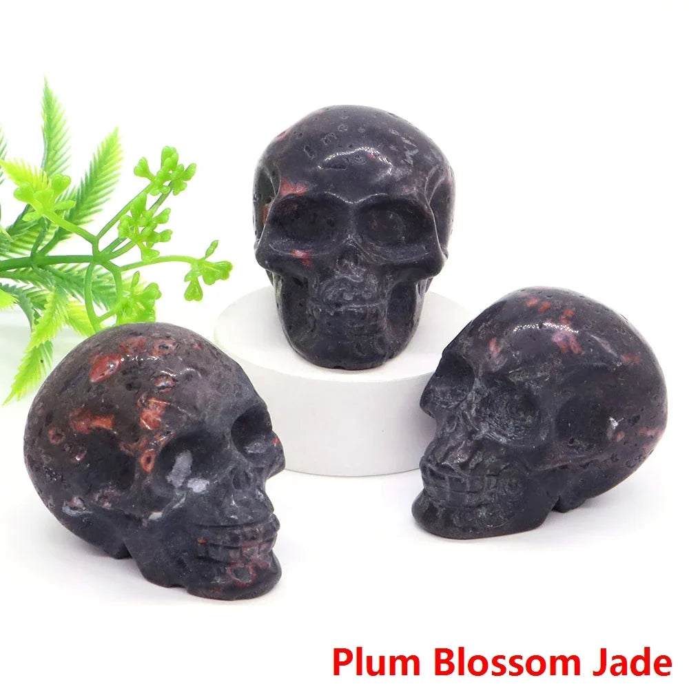Carved gemstone crystal skull sculpture on a dark surface — view 8 of 12