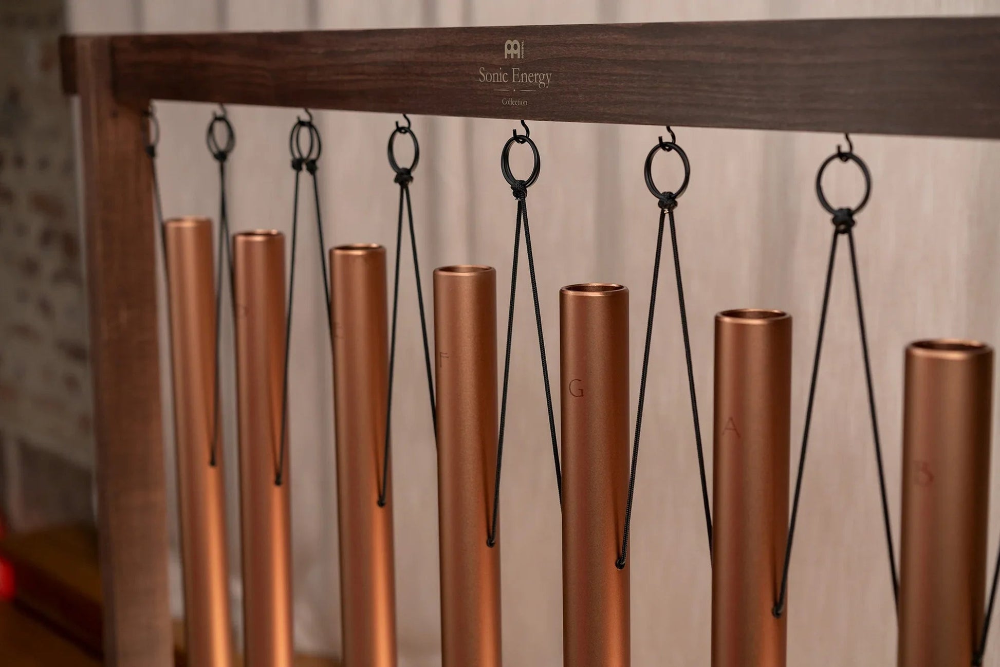 Eight-piece sound bath tube chime set in bronze with removable wooden holders — view 6 of 7