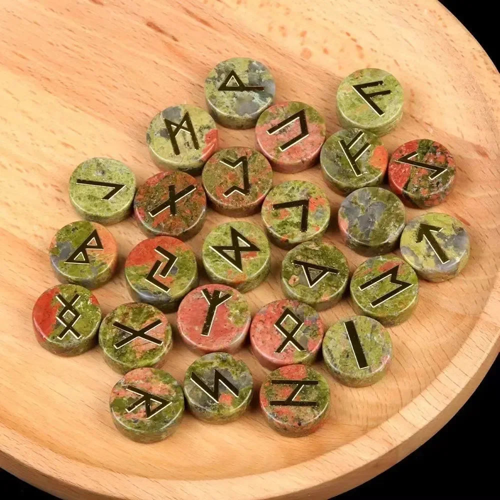 Set of round polished crystal runes engraved with runic symbols, scattered on a dark surface — view 12 of 12