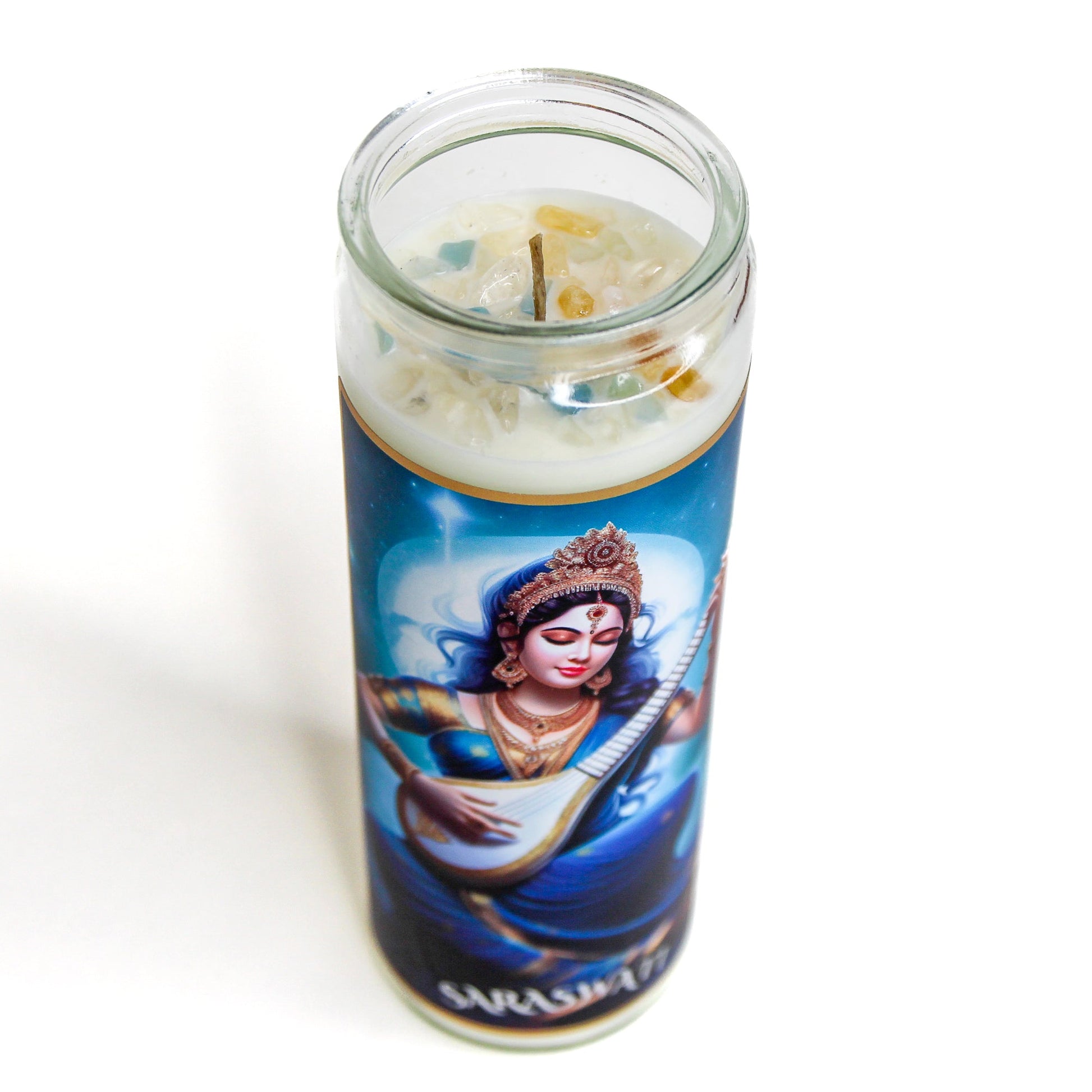 Saraswati Crystal Altar Candle in a 16 oz glass tumbler with an image of the goddess Saraswati on the label and crystals set into the wax — product photo 4