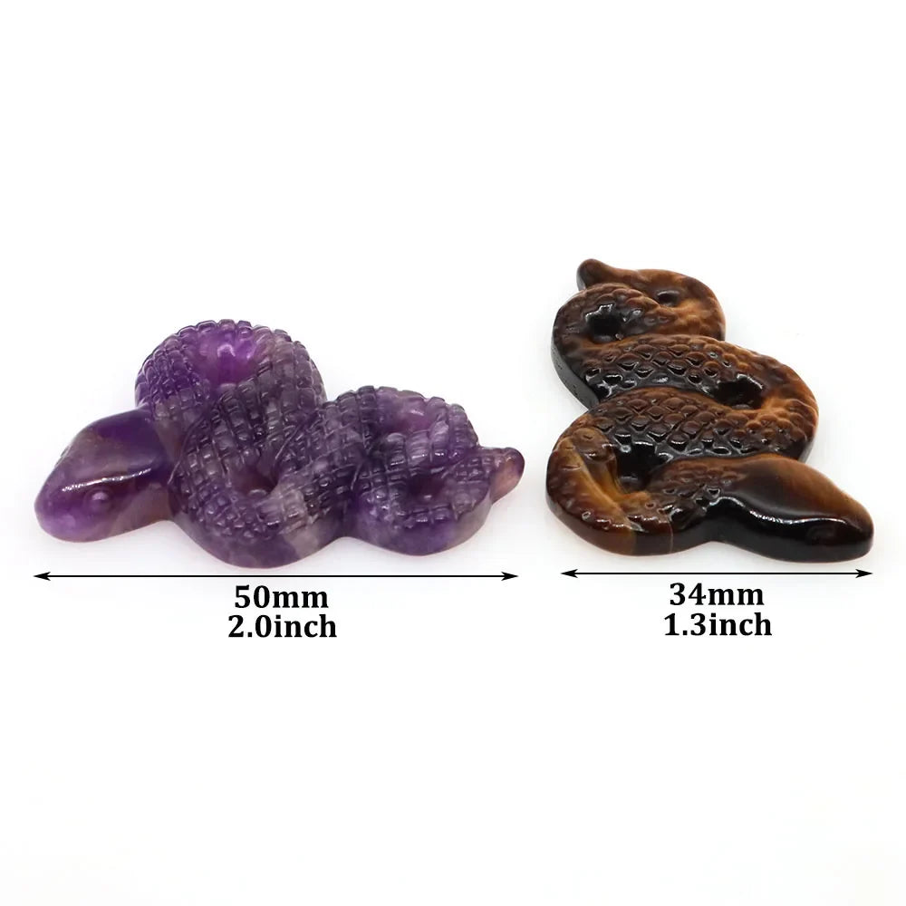 Carved gemstone snake figurine coiled on a dark surface — view 6 of 12