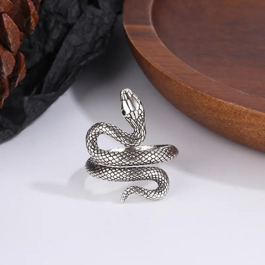 Adjustable sterling silver snake ring coiled around a finger form — view 1 of 5