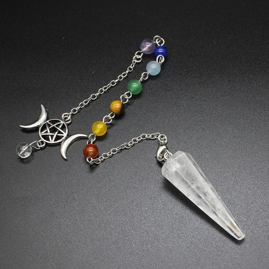 Hexagonal crystal point pendulum with a triple moon pentacle chakra cap, hanging from a fine silver-tone chain