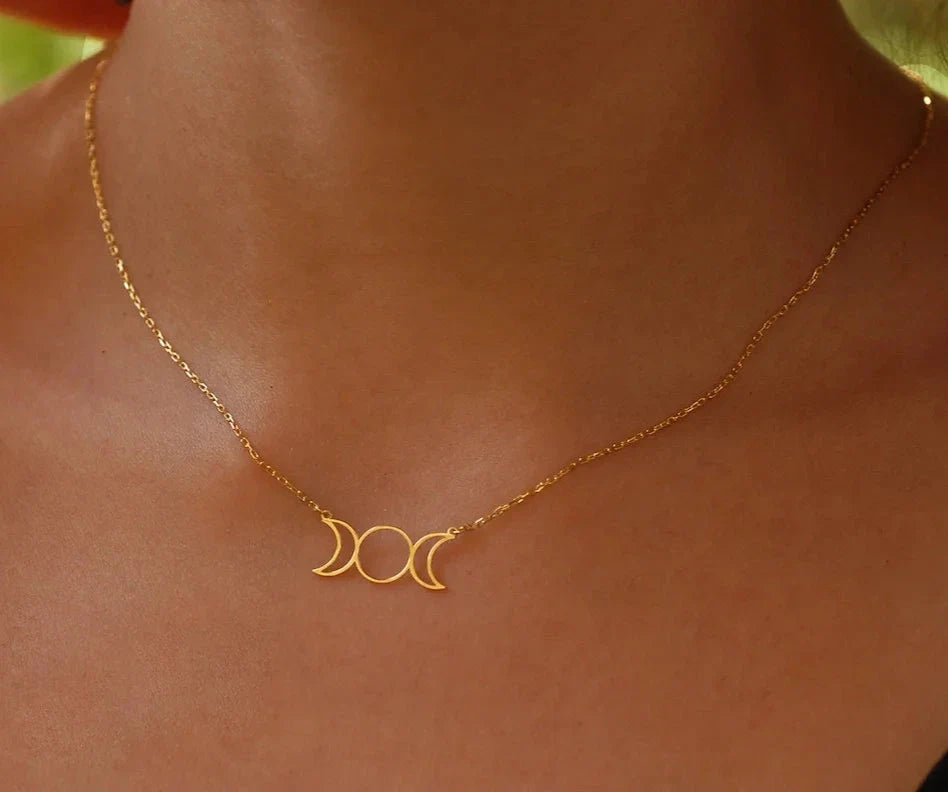 Stainless steel Triple Moon Goddess pendant necklace showing waxing, full and waning moons on a fine chain — product photo 5