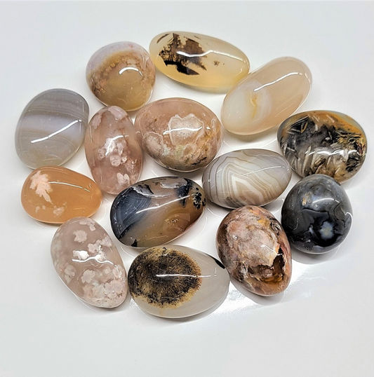 A-quality mixed agate tumbled pocket stones showing banded cream, red and green patterns