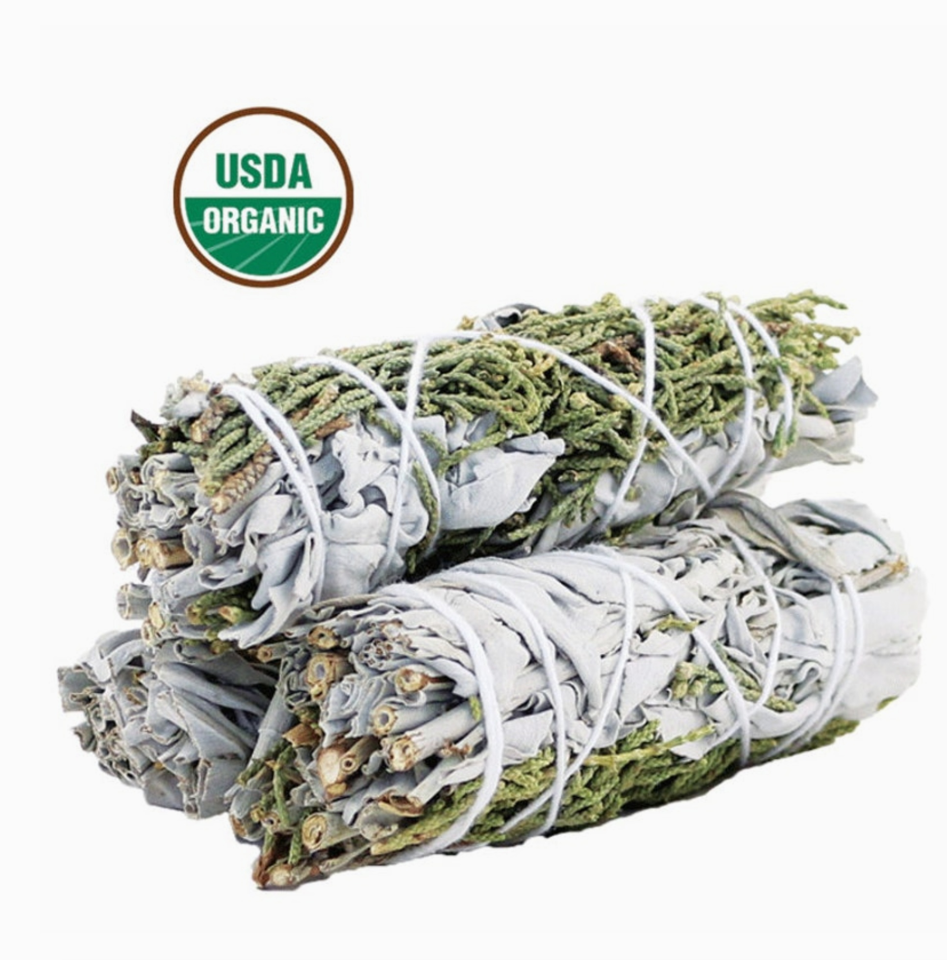 Hand-tied four-inch smudge stick of white sage bundled with juniper sprigs