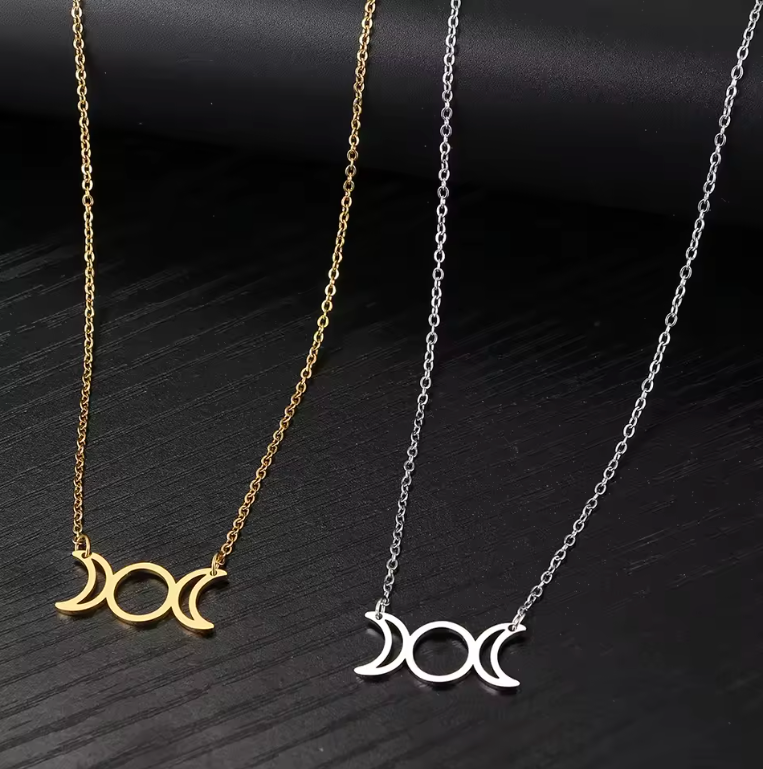 Stainless steel Triple Moon Goddess pendant necklace showing waxing, full and waning moons on a fine chain