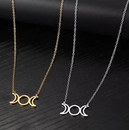 Stainless steel Triple Moon Goddess pendant necklace showing waxing, full and waning moons on a fine chain