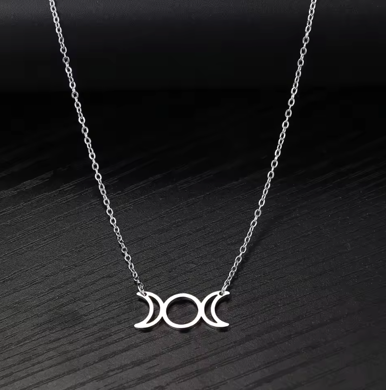 Stainless steel Triple Moon Goddess pendant necklace showing waxing, full and waning moons on a fine chain — product photo 3