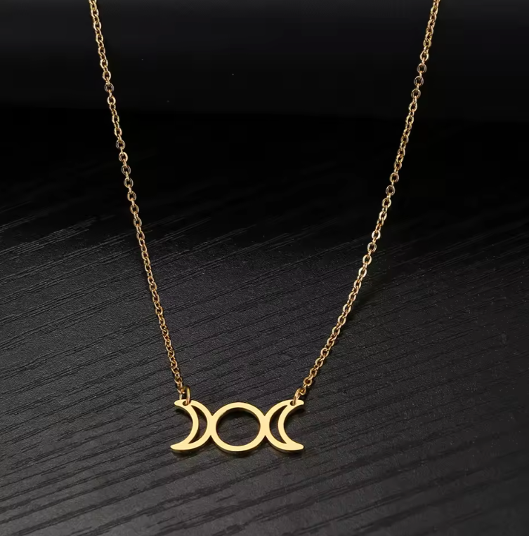 Stainless steel Triple Moon Goddess pendant necklace showing waxing, full and waning moons on a fine chain — product photo 2
