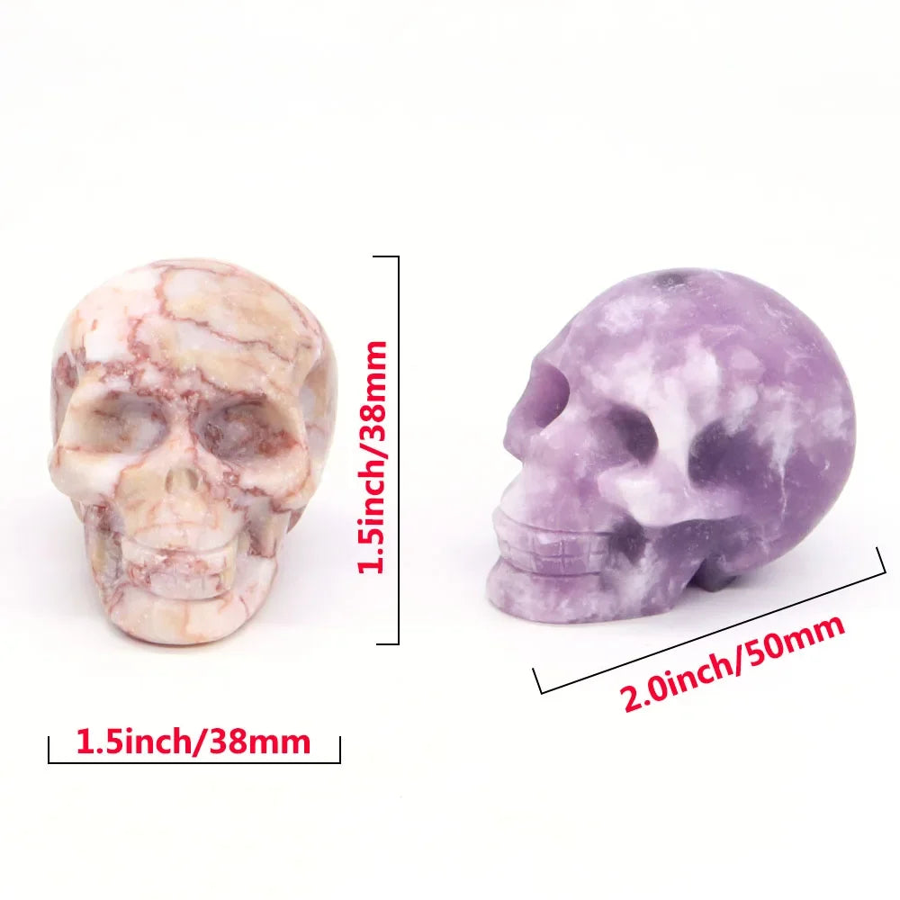 Carved gemstone crystal skull sculpture on a dark surface — view 7 of 12