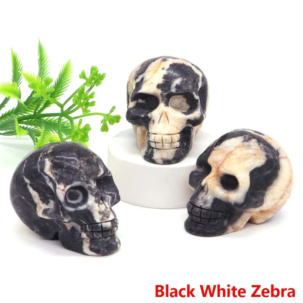 Carved gemstone crystal skull sculpture on a dark surface — view 12 of 12