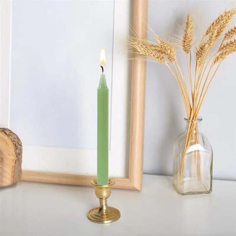Set of twelve colored ritual taper candles in red, pink, purple, blue, green, yellow, white and black, laid out in a row — product photo 3