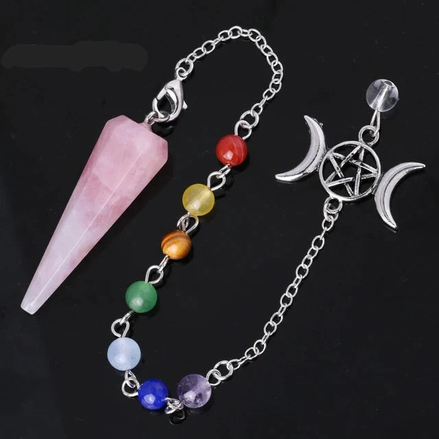 Hexagonal crystal point pendulum with a triple moon pentacle chakra cap, hanging from a fine silver-tone chain — product photo 5