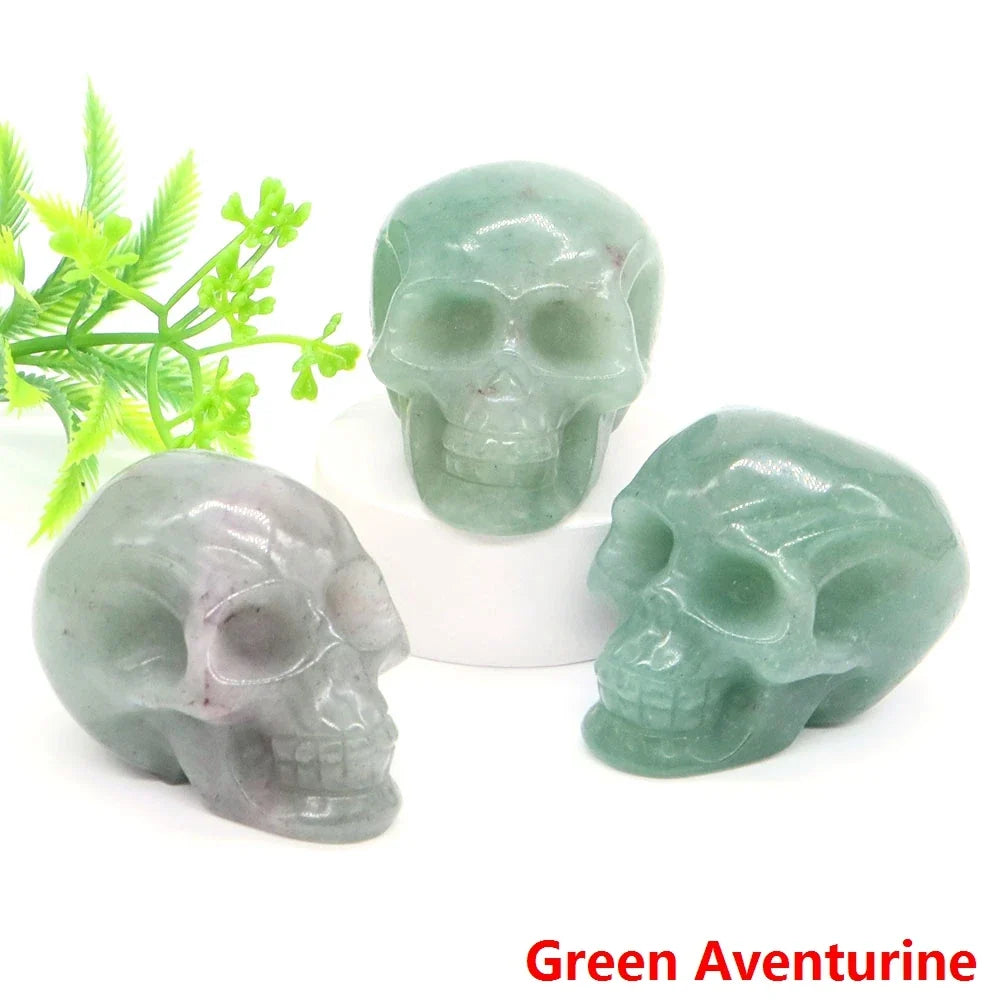 Carved gemstone crystal skull sculpture on a dark surface — view 9 of 12
