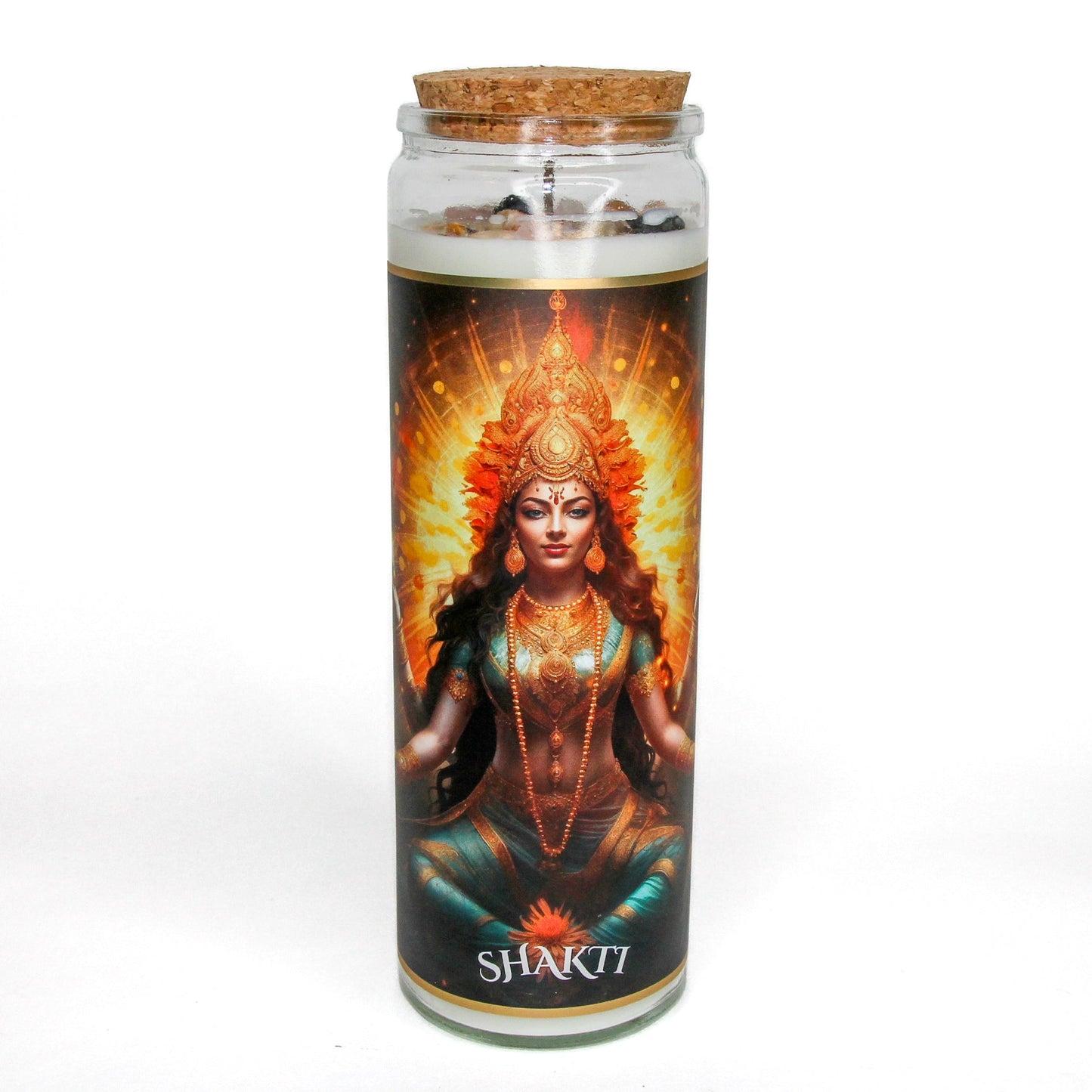 Shakti Ma crystal altar candle in a clear glass vessel, topped with crystals