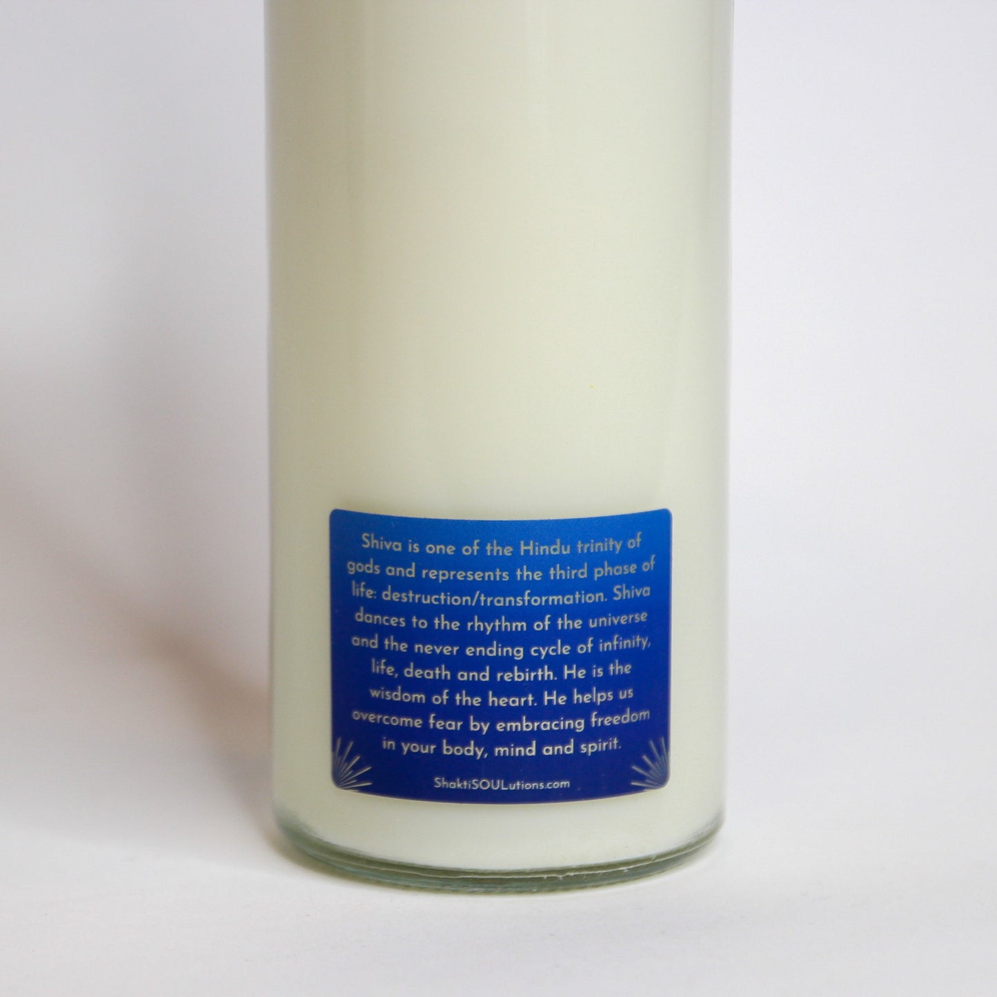 Back of the Shiva altar candle showing the printed image and inscription