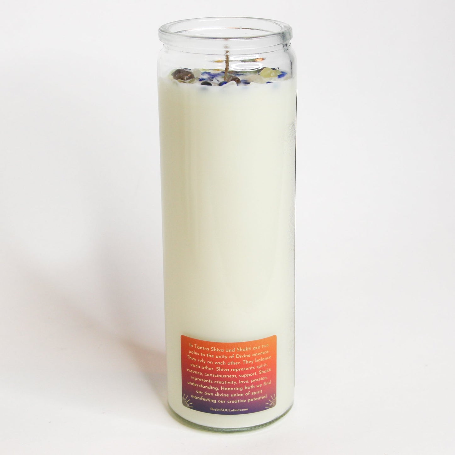 The Shiva Shakti altar candle lit, showing the flame and melt pool