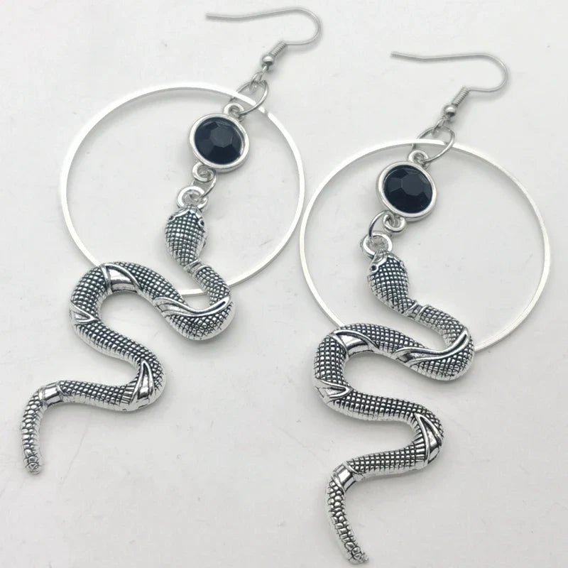 Stainless steel snake hoop earring with a black stone set in the serpent head — view 2 of 3
