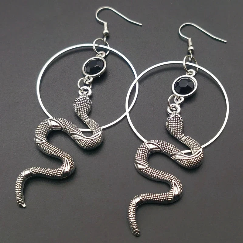 Stainless steel snake hoop earring with a black stone set in the serpent head — view 1 of 3