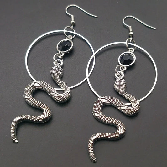 Stainless steel snake hoop earring with a black stone set in the serpent head — view 1 of 3