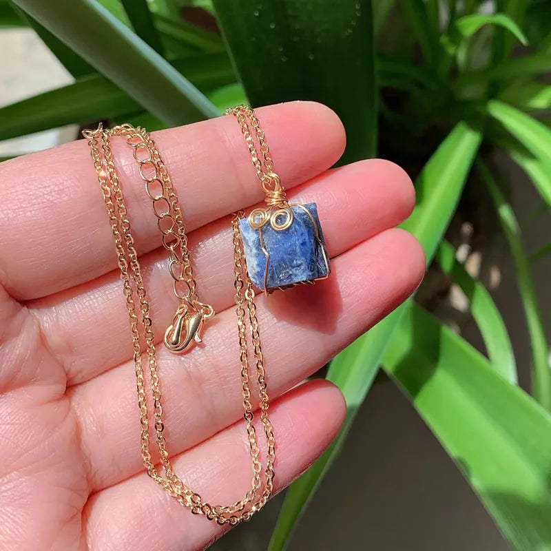 Raw wire-wrapped crystal pendant on a gold-plated stainless steel link chain — view 12 of 20