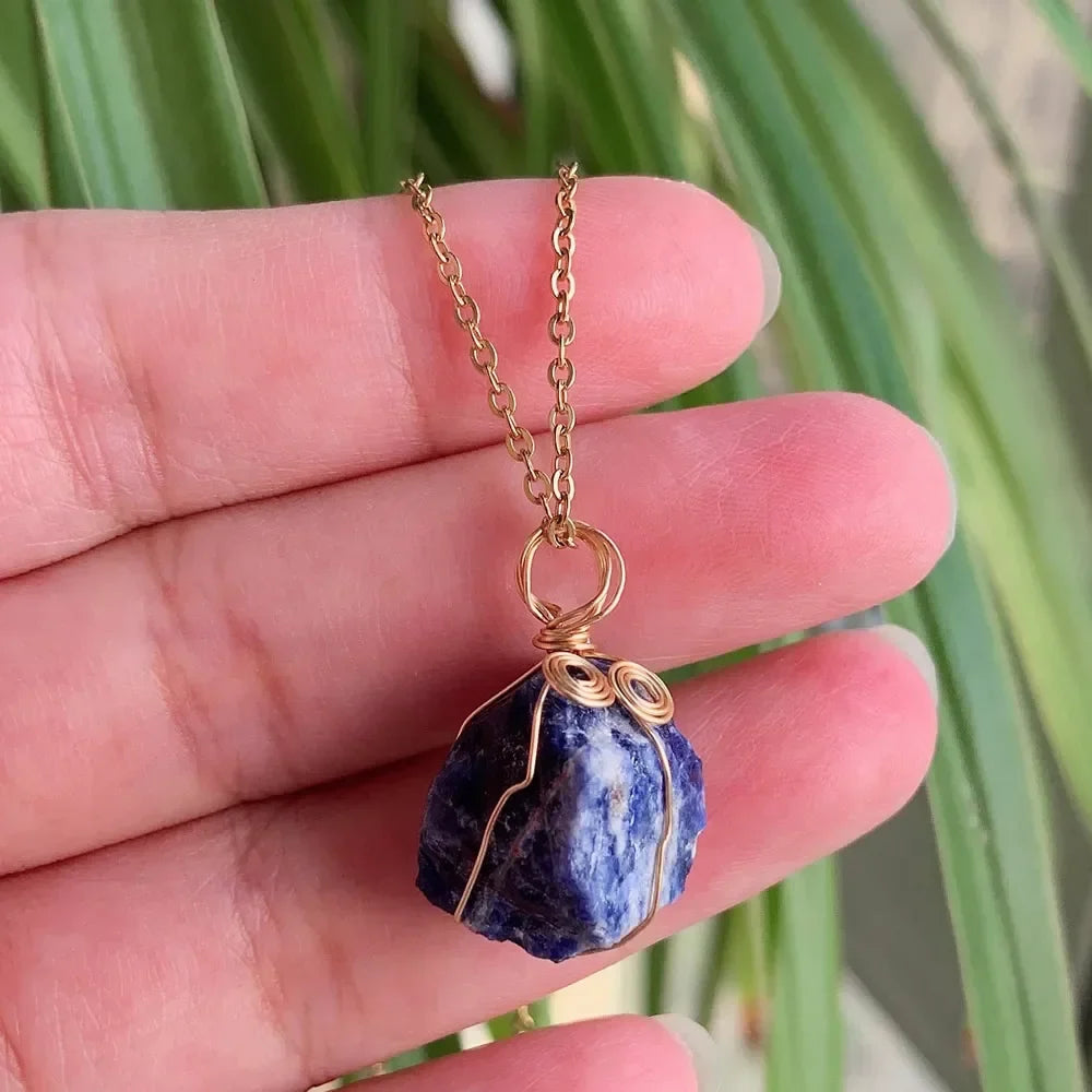 Raw wire-wrapped crystal pendant on a gold-plated stainless steel link chain — view 19 of 20