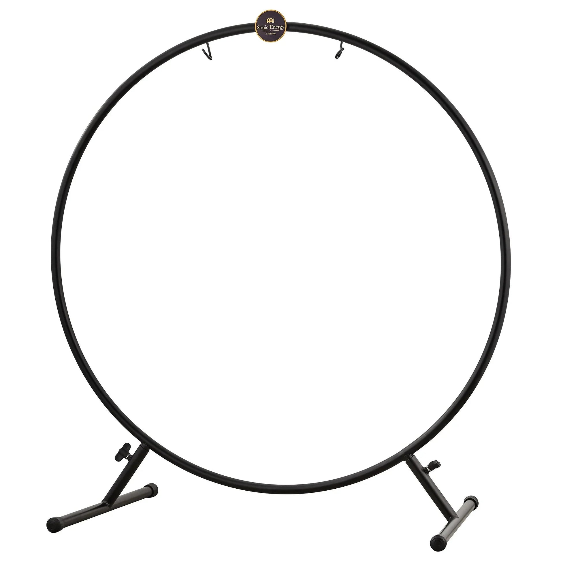 Black powder-coated round Meinl Sonic Energy gong stand shown in a warm, softly lit styled scene.
