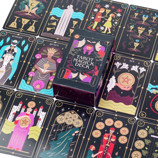 The Witch of the Forest's Tarot Magick Deck with illustrated cards fanned out beside the printed guidebook