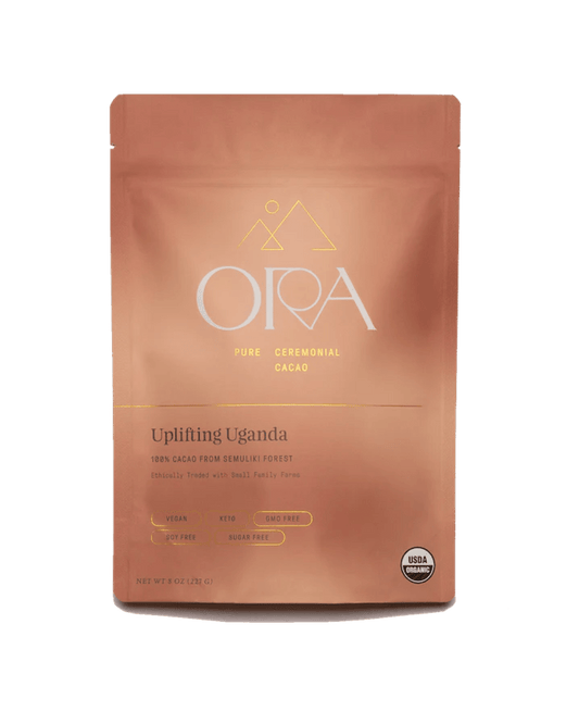 Ora Cacao Uplifting Uganda pure ceremonial cacao shown on a plain neutral background.