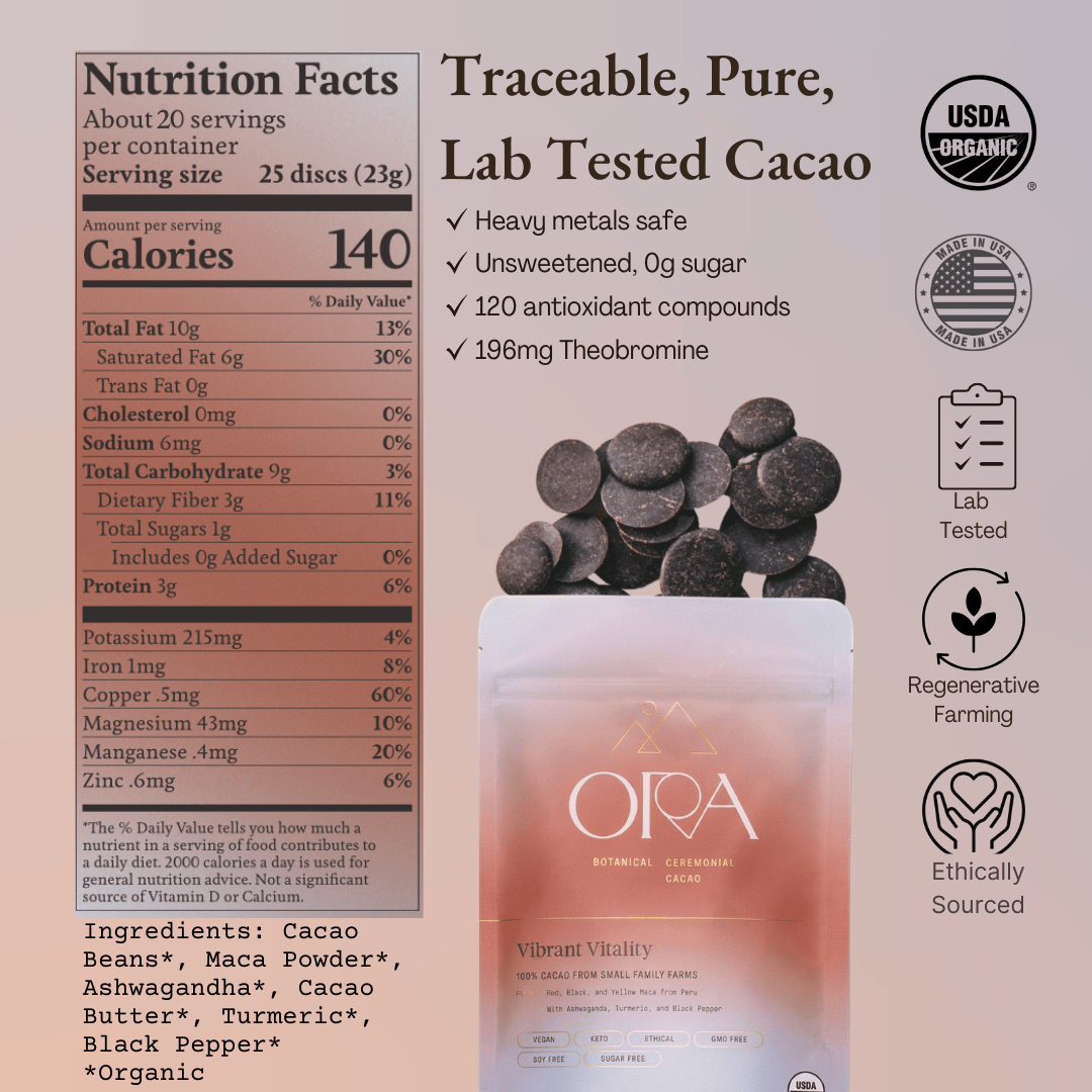 Ora Cacao Vibrant Vitality ceremonial cacao blend shown in a warm, softly lit styled scene.