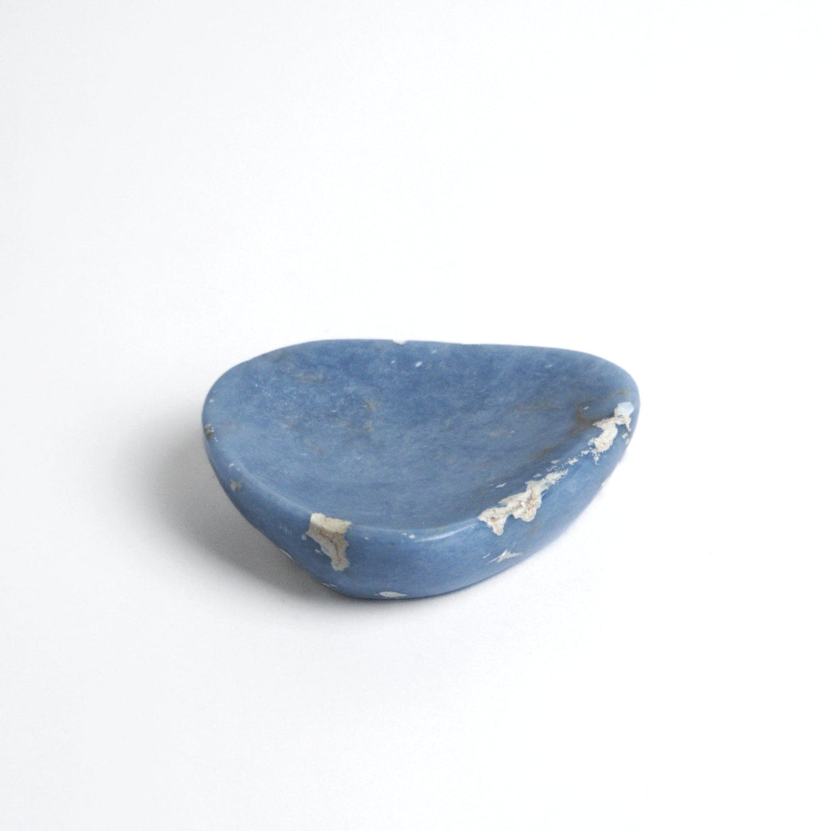 Angelite catchall seen from the side, showing the shallow carved well
