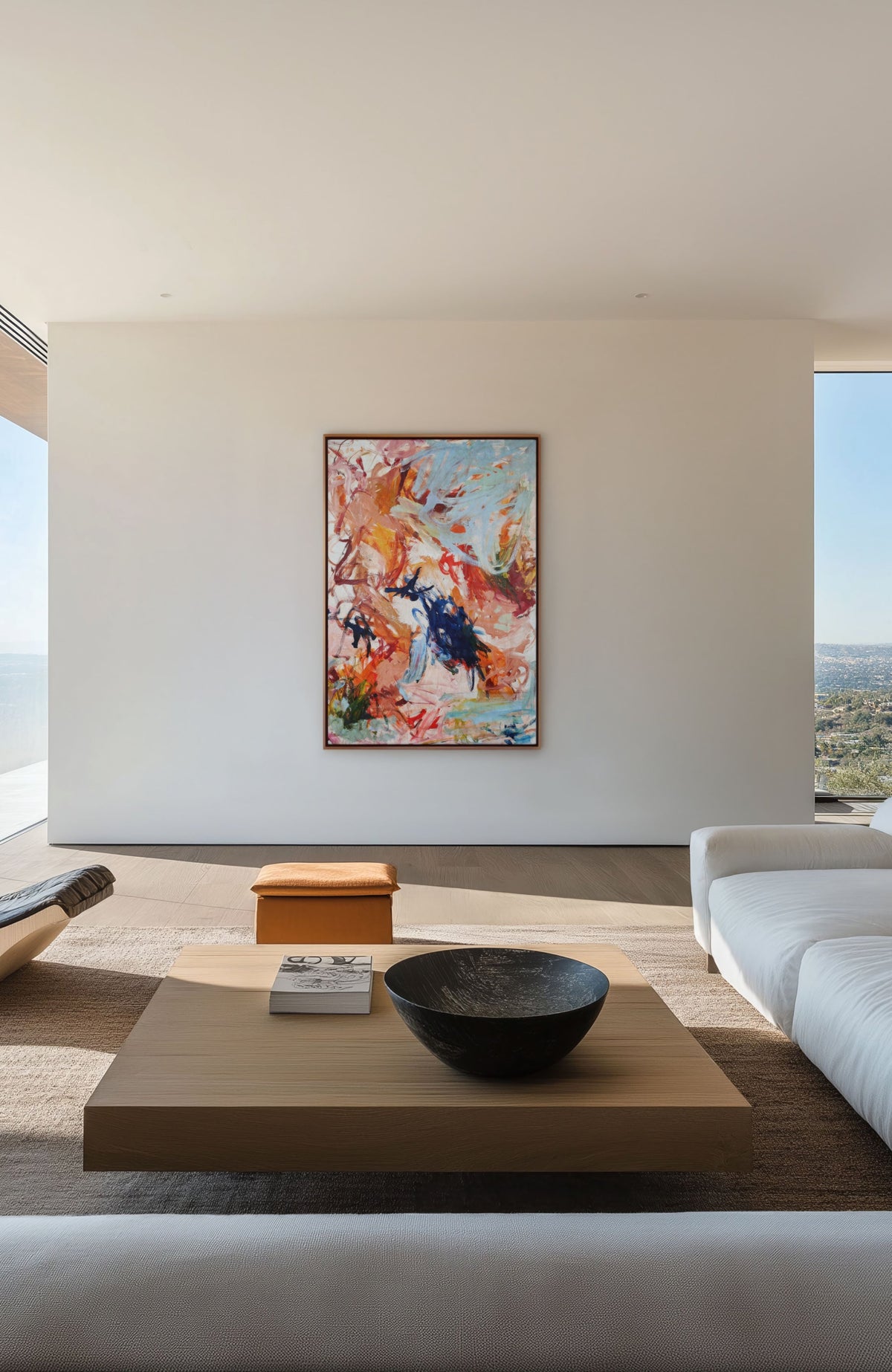 Dream Big canvas on a white wall in an open living room with a low table
