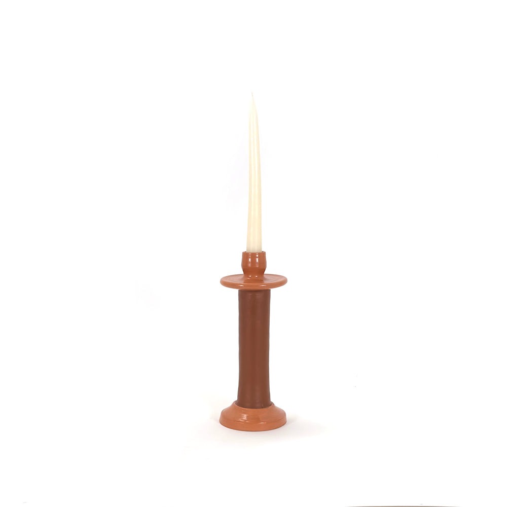 Small terracotta leather-wrapped candle holder with a cream taper candle