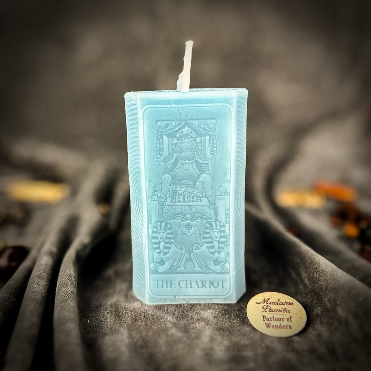 Light blue beeswax The Chariot tarot card candle with the charioteer molded in relief