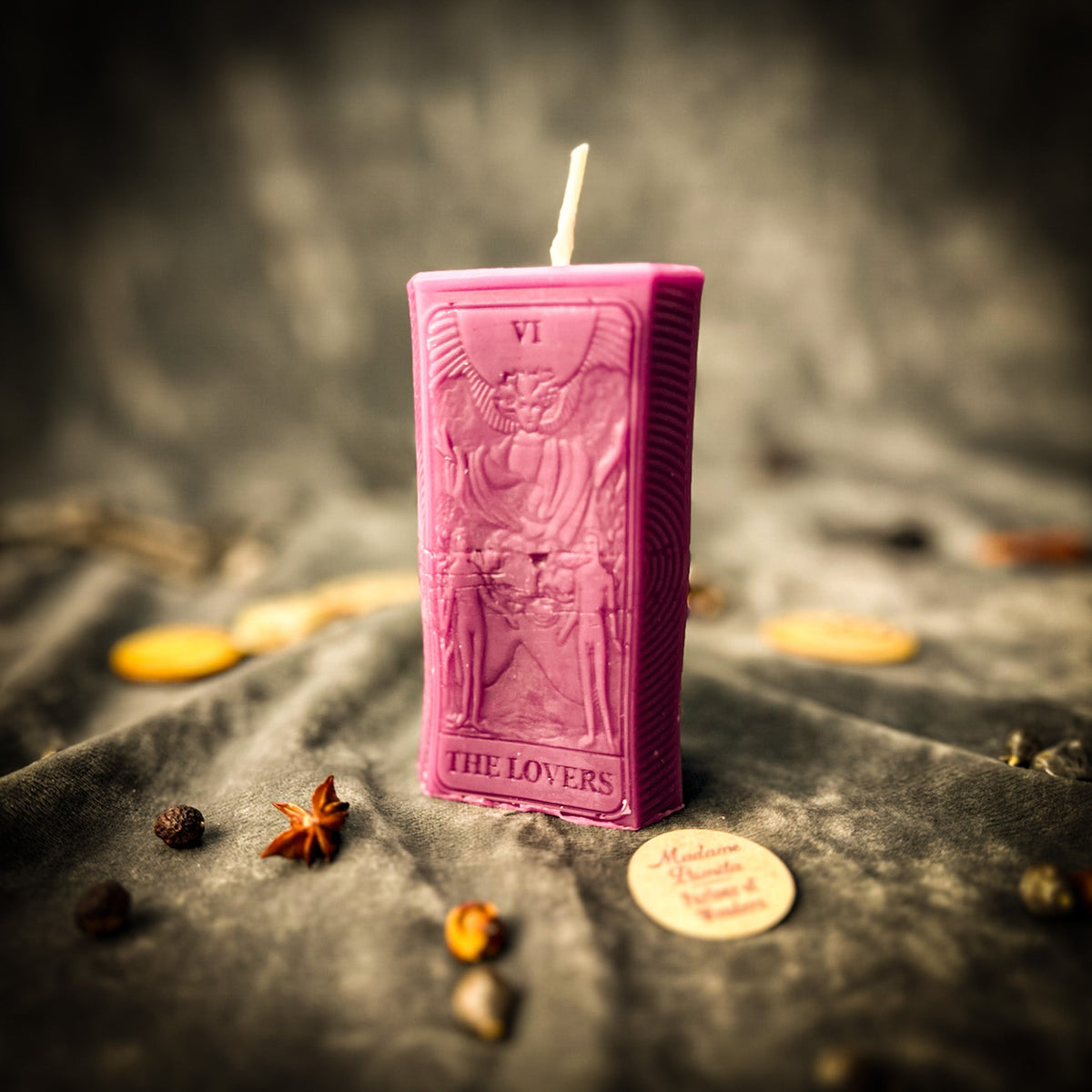 Magenta pink beeswax The Lovers tarot card candle, the relief design clearly visible