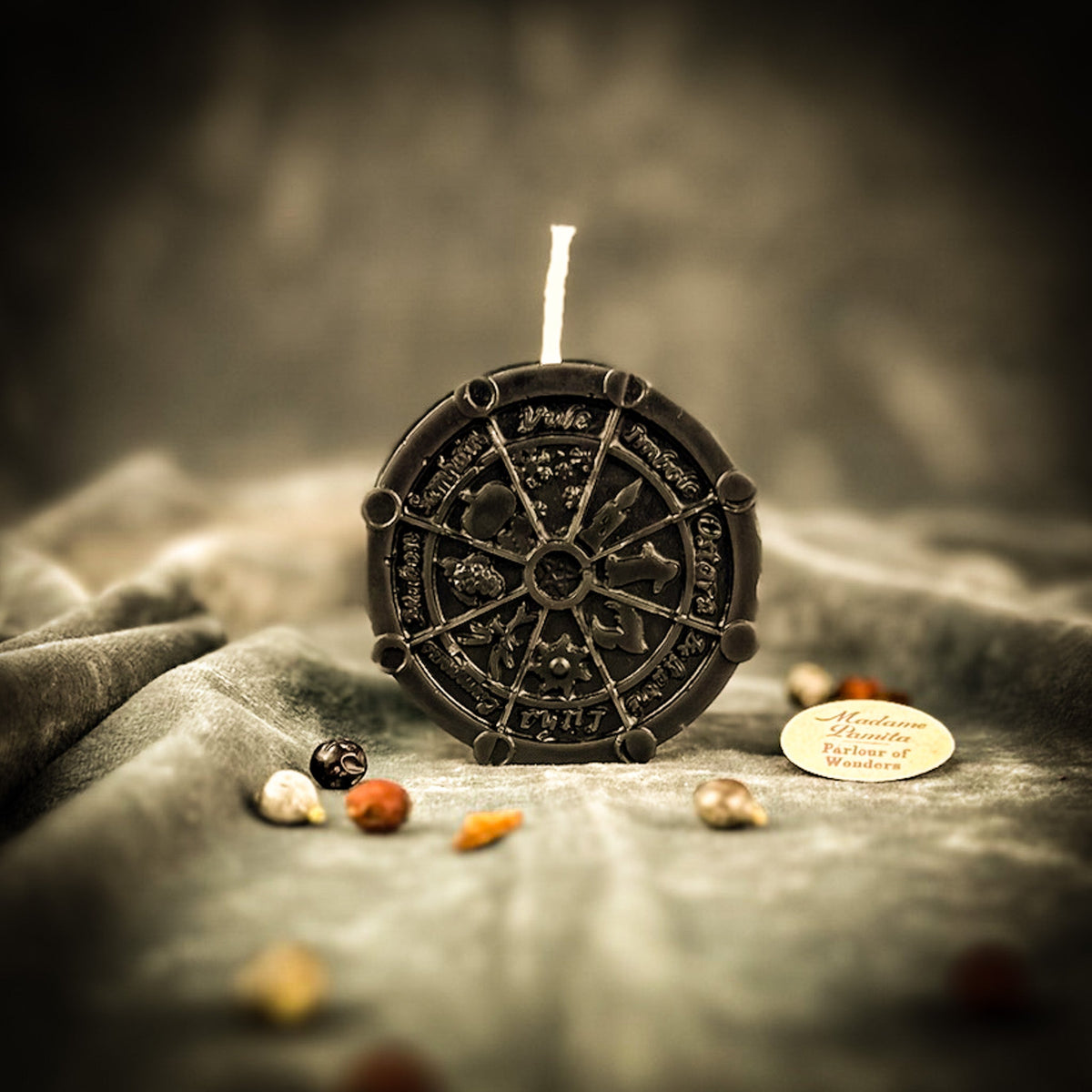Black Wheel of the Year candle, the wheel showing as highlights on dark wax.