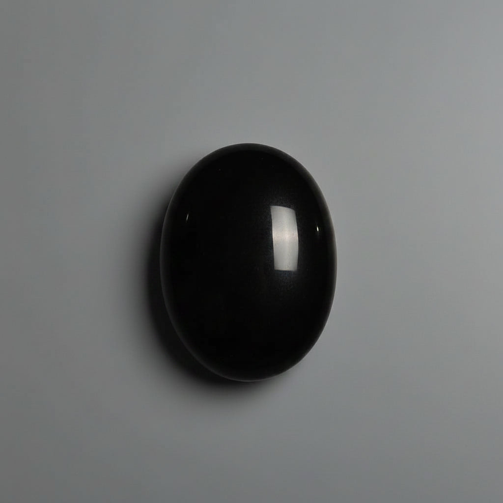 Polished black obsidian comfort stone shown from another angle