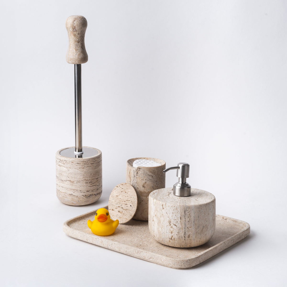 Travertine tray in a bathroom set with soap dispenser, jar and brush holder