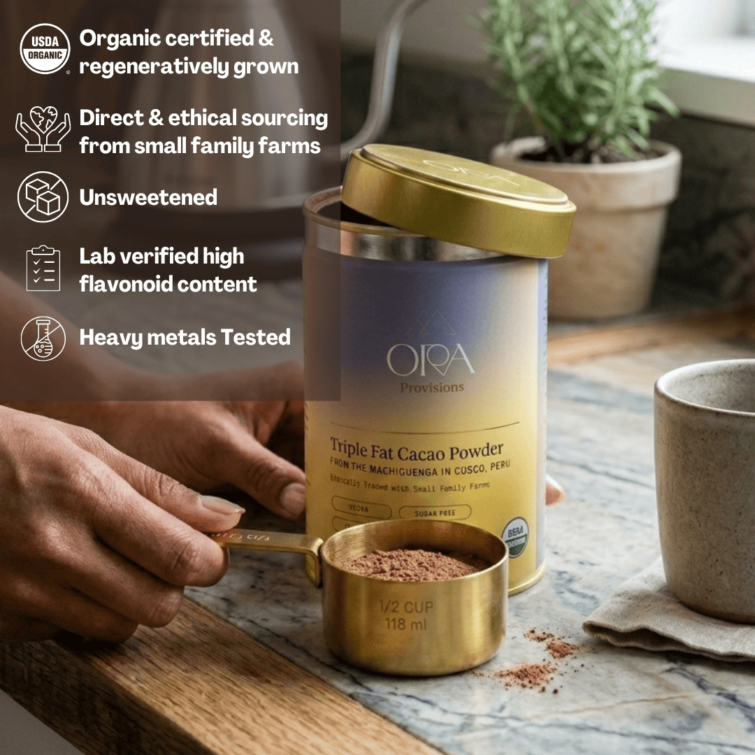 Ora Cacao Triple Fat cacao powder tin displayed in a calm, styled interior setting.