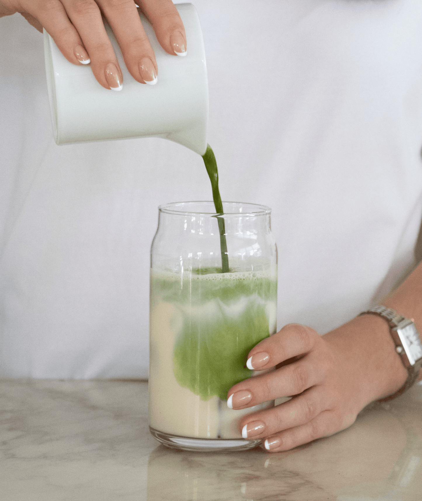 Can Cup filled with an iced matcha latte and ice