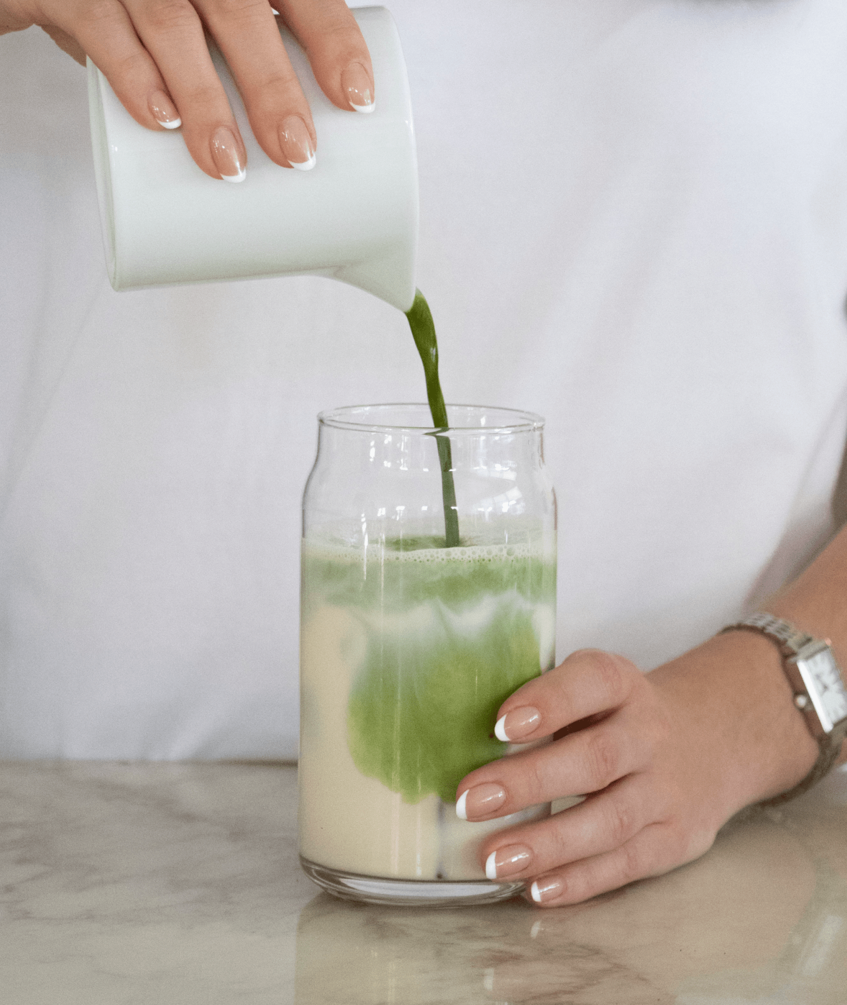 Can Cup filled with an iced matcha latte and ice