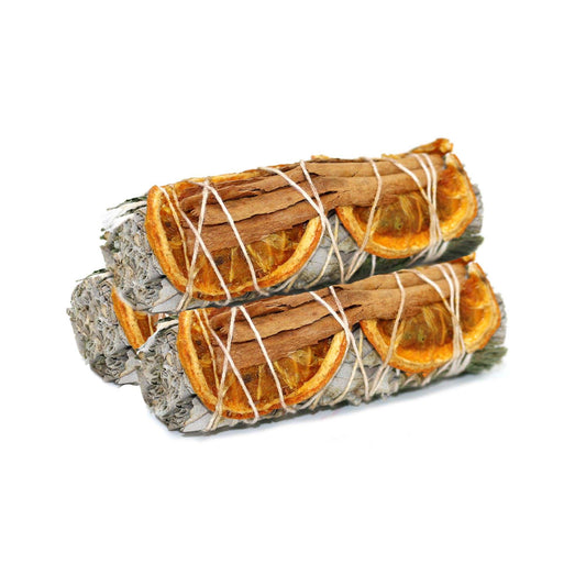 Four-inch white sage smudge stick bound with cinnamon sticks and dried orange slices
