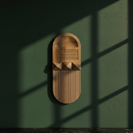 Planos I pine wall relief mounted on a dark green wall in raking sunlight