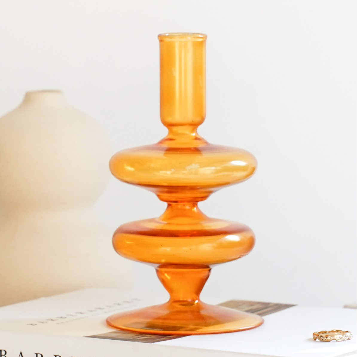 Amber Gigi glass candle holder showing the stacked disc stem