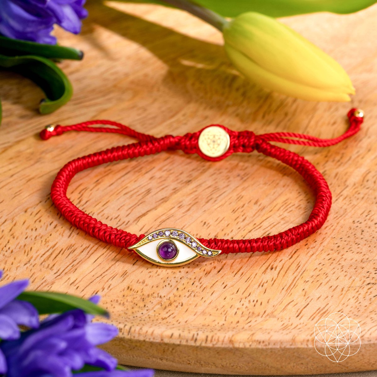 Four-strand red string bracelet with a 14K gold-plated evil eye charm set with a purple amethyst iris — detail view 5