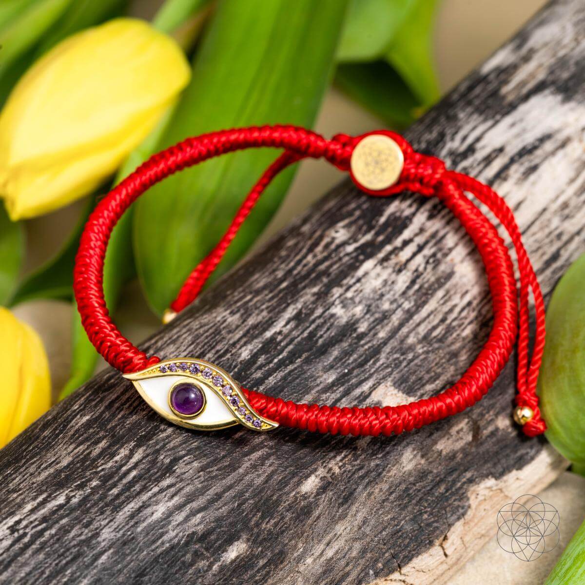 Four-strand red string bracelet with a 14K gold-plated evil eye charm set with a purple amethyst iris — detail view 6