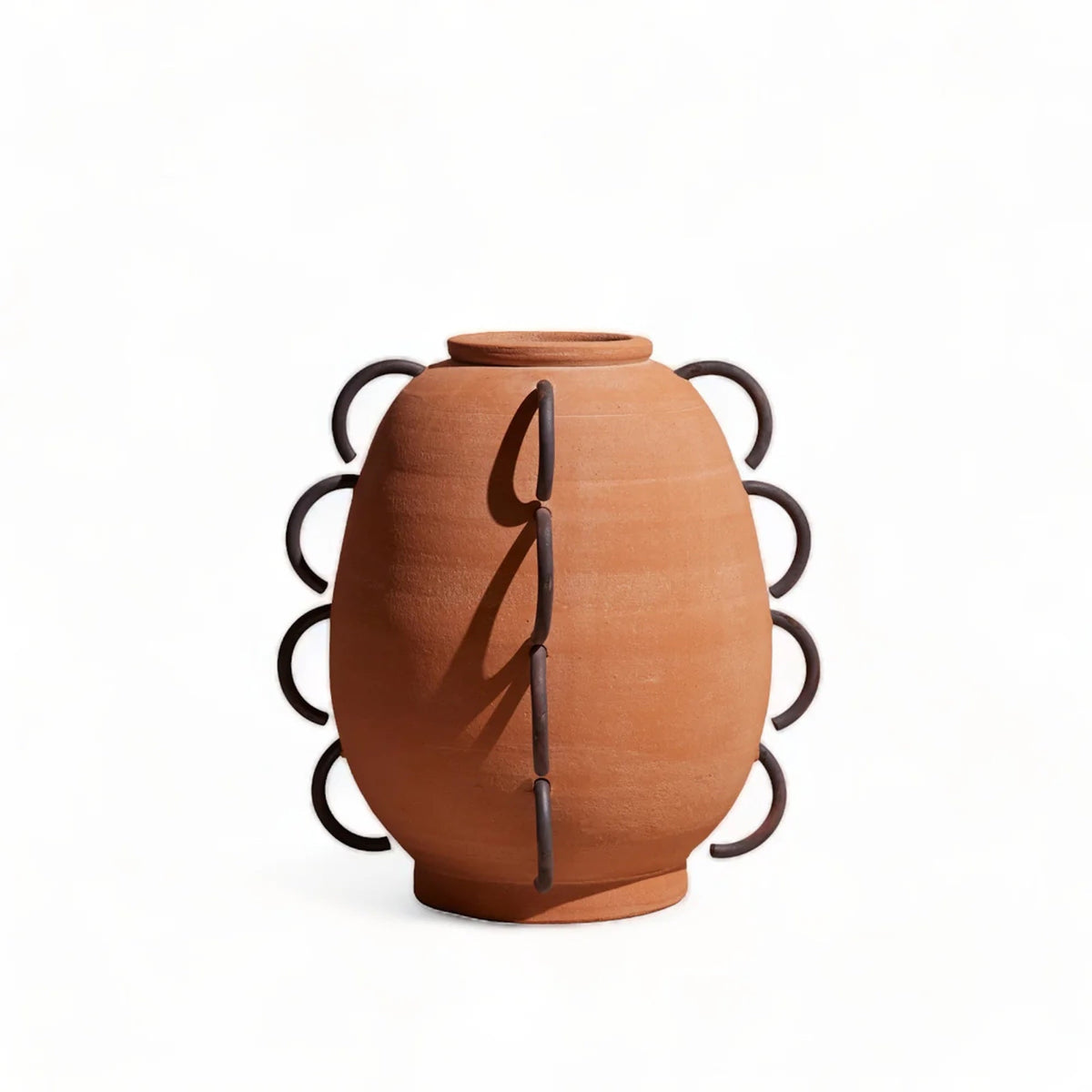 Ella terracotta vessel on white, showing the scalloped iron loops down both sides