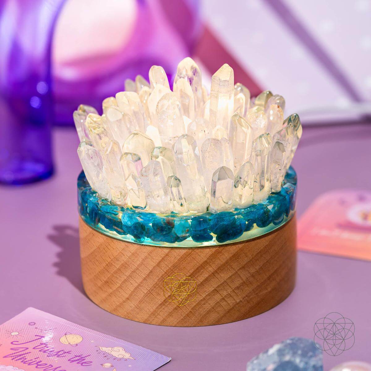 Blue Apatite and Clear Quartz crystal lamp glowing on a wooden base — view 2
