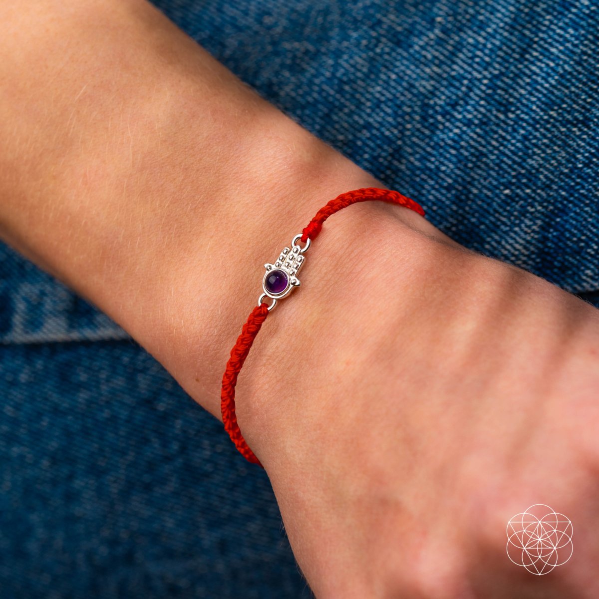 Four-strand red string bracelet with a silver-plated hamsa hand charm set with a purple Brazilian amethyst — detail view 2